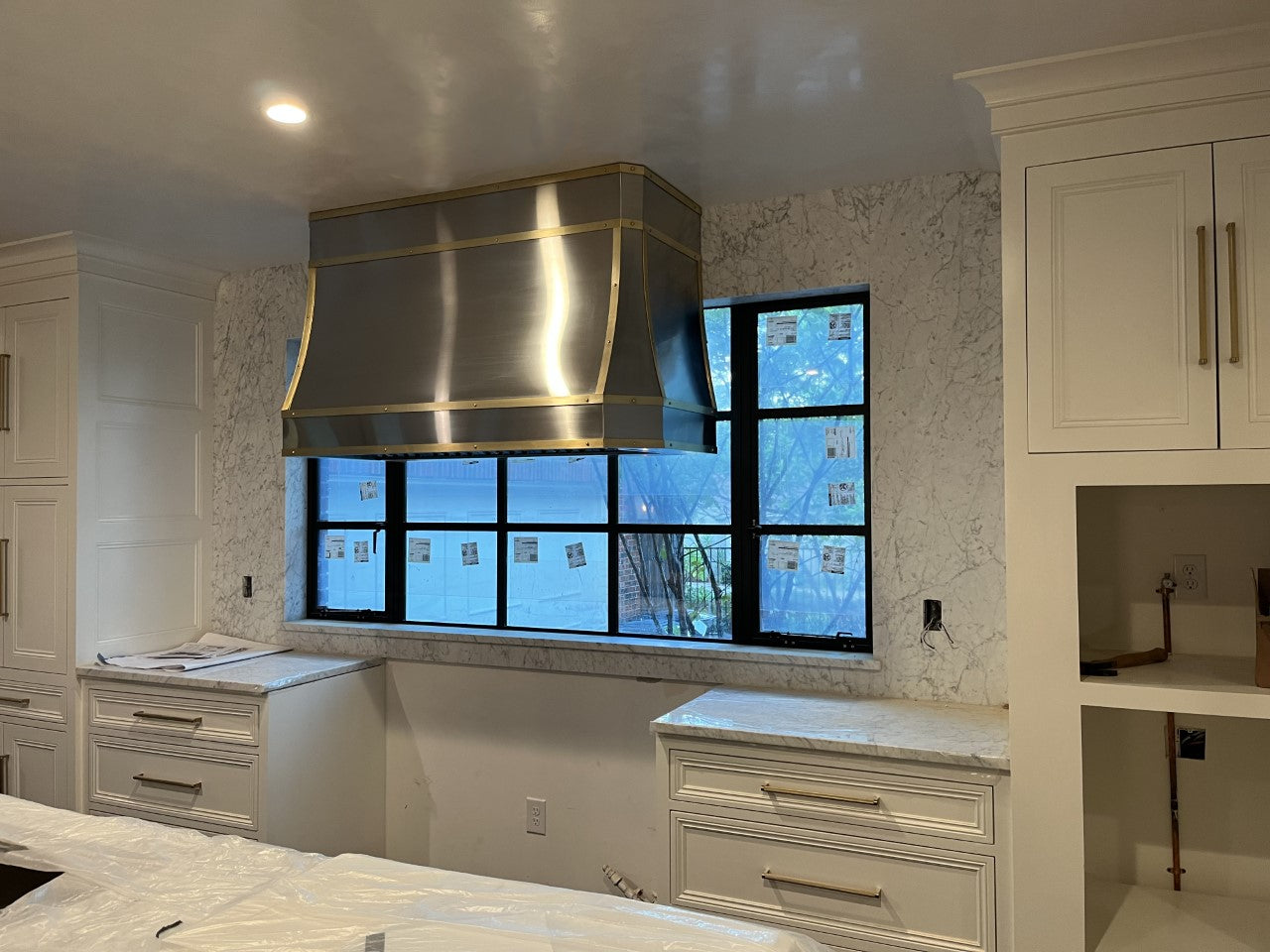 Stainless Steel Multi-Curved Range Hood With Brass Strapping